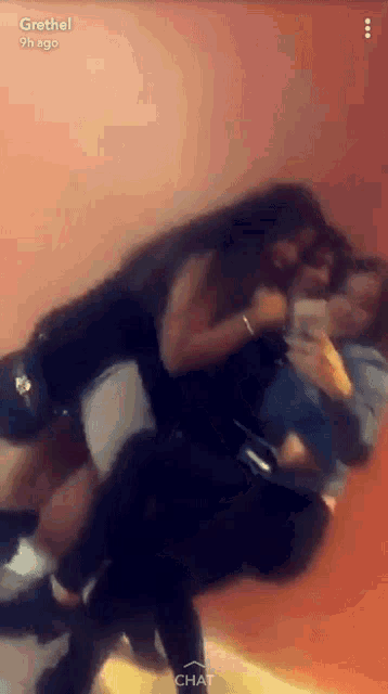 a group of people are taking a selfie in front of a mirror with the name grethel on the bottom right