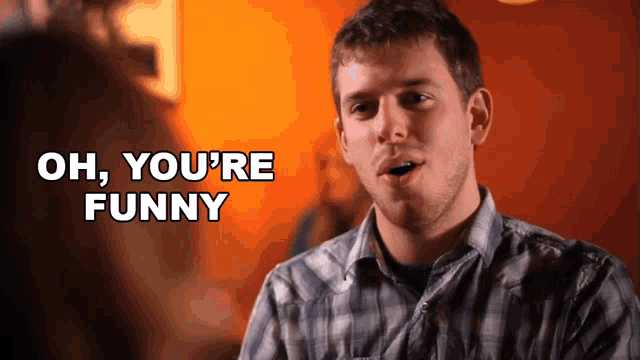 a man in a plaid shirt says oh you 're funny in front of an orange background