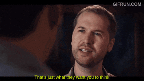 a gif from gifrun.com shows a man pointing at another man