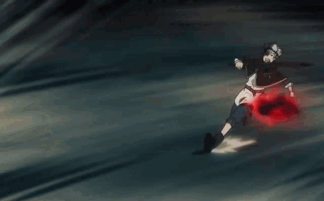 a person is holding a sword and a red object in their hand .
