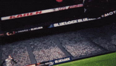 a blurred image of a sports stadium with a bluelock banner in the foreground