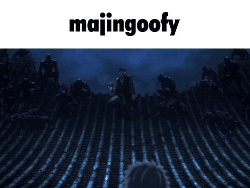 a picture of a man standing in front of a wall with majingoofy written above it