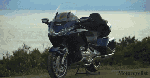a motorcycle is parked on the side of a road with the words motorcyclist below it