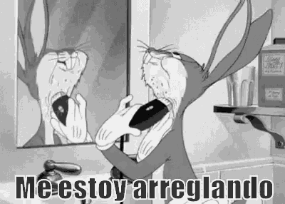 bugs bunny is looking at himself in the mirror while brushing his teeth .