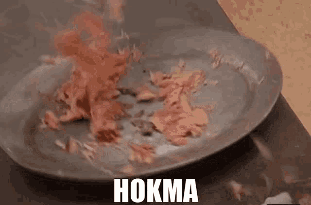 a plate of food with the word hokma on it