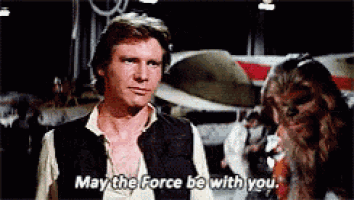 han solo and chewbacca from star wars are talking to each other and chewbacca says may the force be with you .