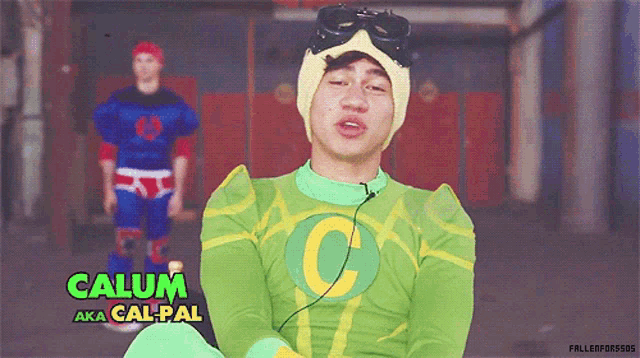a man in a green superhero costume named calum aka cal pal