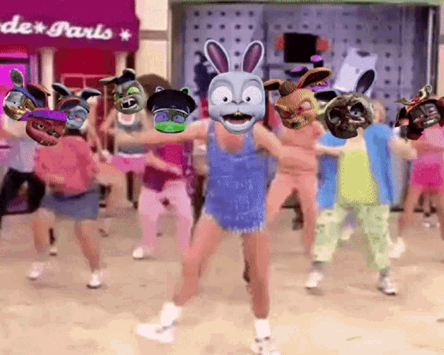 a group of people are dancing in front of a store that says " de paris "