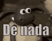 a sheep with big eyes and the words `` de nada '' written on it .