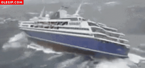 a large blue and white ship is floating in the ocean with olegif.com in the corner