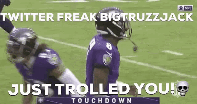 a ravens football player is being tackled by another player .