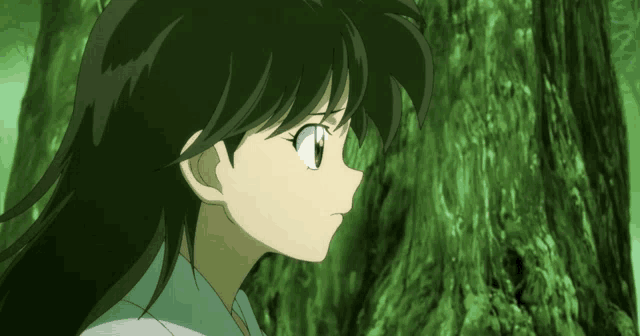 a close up of a girl 's face with a green background