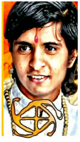 a close up of a man 's face with the letter s on his forehead