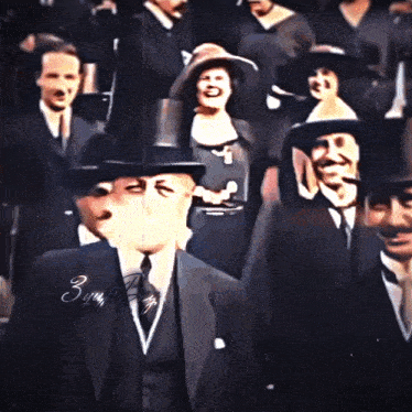 a man in a top hat stands in a crowd of people with the signature bunny boy