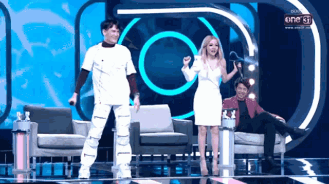 a group of people standing on a stage with one 31 written on the bottom
