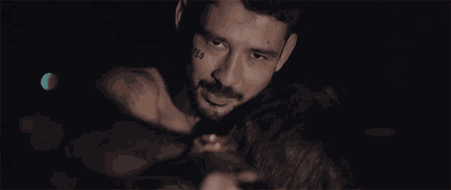 a man with a tattoo on his arm with the word freedom on it