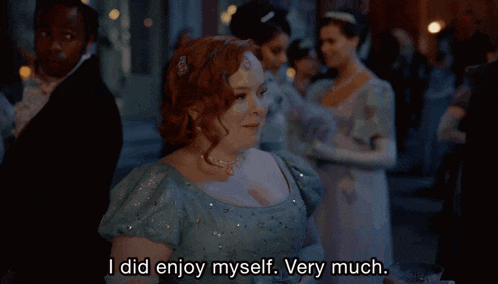 a woman in a blue dress is saying " i did enjoy myself very much "