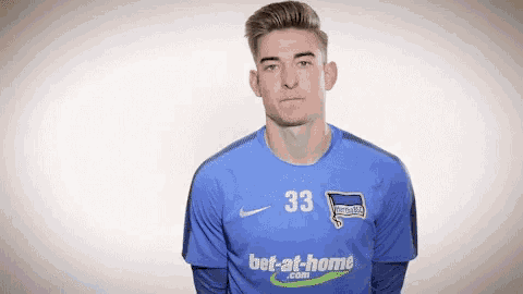 a soccer player with the number 33 on his shirt