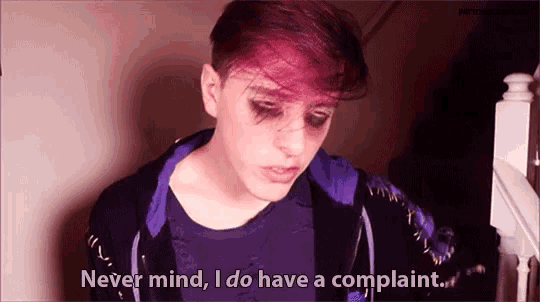 a young man with purple hair says never mind , i do have a complaint .