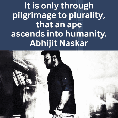 a man stands in front of a sign that says it is only through pilgrimage to plurality that an ape ascends into humanity
