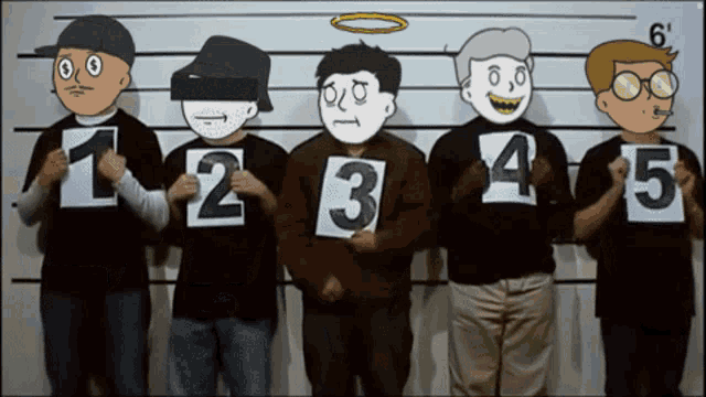 a group of people holding up signs with the numbers 1 2 3 4 and 5 on them