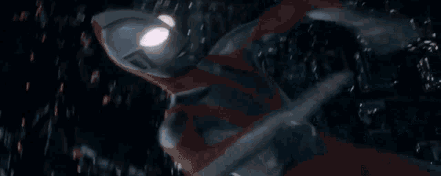 a close up of a person 's face in a dark room with a lot of lights coming out of it .