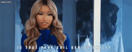 a woman is wearing a blue shirt that says is that your evil genius smile