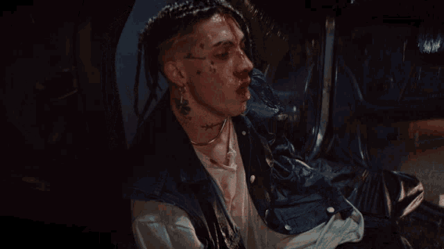 a man with a tattoo on his face that says ' miami '