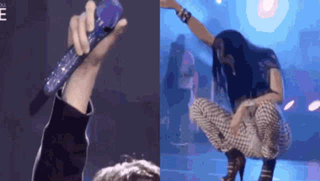 a hand holding a microphone next to a woman kneeling down on a stage
