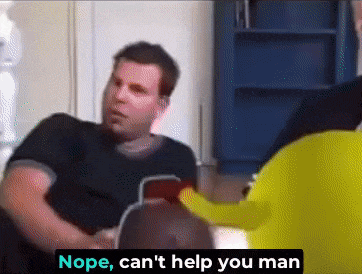a man is sitting on a couch talking to shrek .