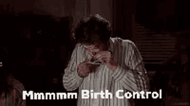 a man in a striped shirt is smoking a cigarette and saying `` mmmm birth control '' .