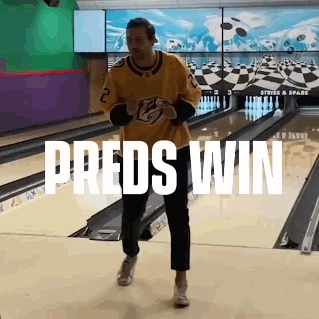 a man in a yellow jersey is walking down a bowling alley and the words preds win are above him