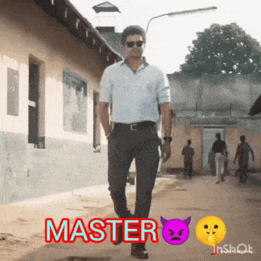 a man in a white shirt and black pants is walking down a street that says master