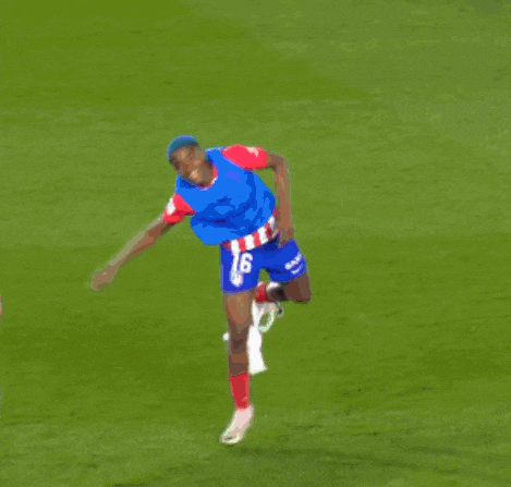 a soccer player with the number 16 on his shorts is surrounded by his teammates