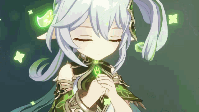 a girl with white hair and green leaves around her is praying with her eyes closed