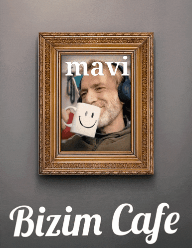 a framed picture of a man holding a mug with a smiley face on it and the words mavi bizim cafe below it