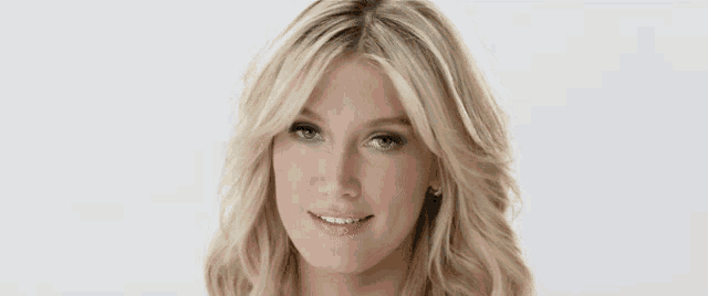 a close up of a woman 's face with a white background