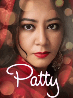 a close up of a woman 's face with the name patty written in white