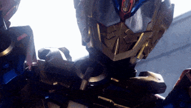 a close up of a robot 's face with the letter o on it