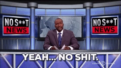 a man in a suit and tie is sitting at a news desk with the words yeah no shit behind him