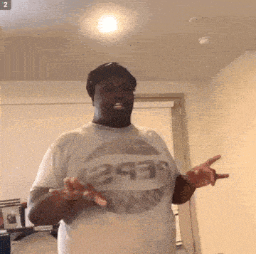 a man wearing a t-shirt that says 2939 on it