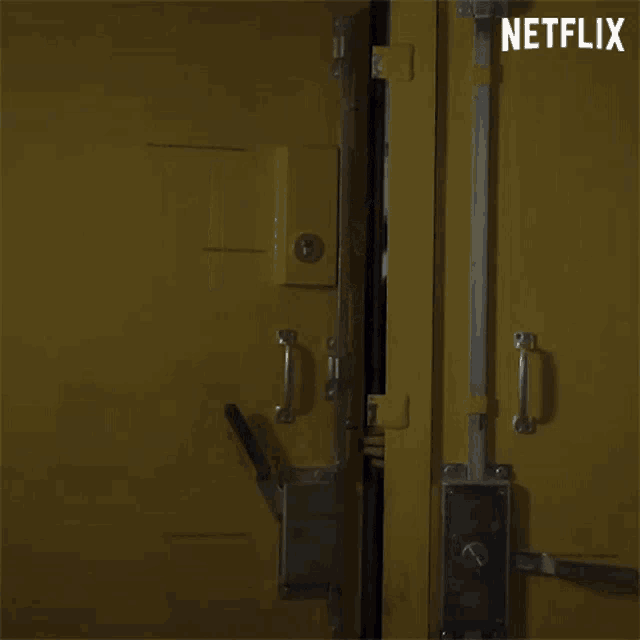 a woman is standing in a yellow door with a netflix logo in the corner