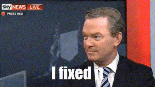 a man in a suit and tie says " i fixed it " on a tv screen