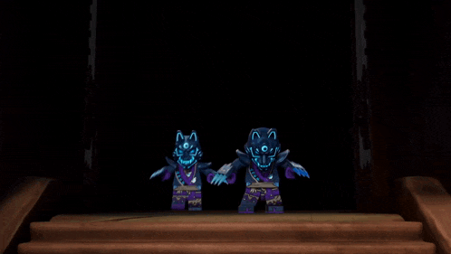 two ninjago characters are dancing in a dark room .