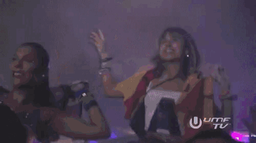 a crowd of people at a concert with the umf tv logo in the foreground