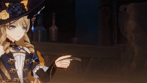 a girl in a witch hat is pointing at something