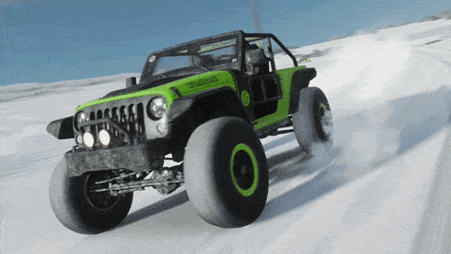 a green and black jeep is driving through a snowy field