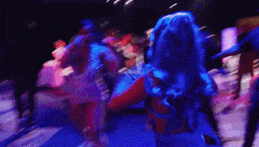 a blurry photo of a woman dancing with the word zeus visible in the corner