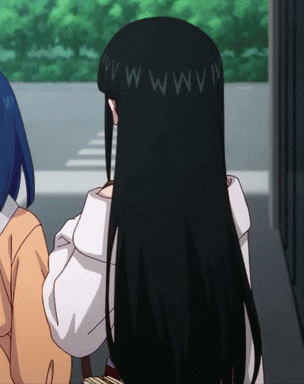 a girl with long black hair has the letters ww on her head