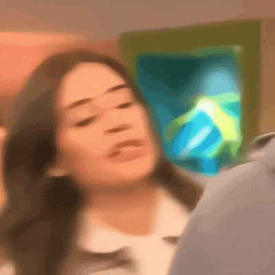 a blurry picture of a woman 's face with a green and blue background